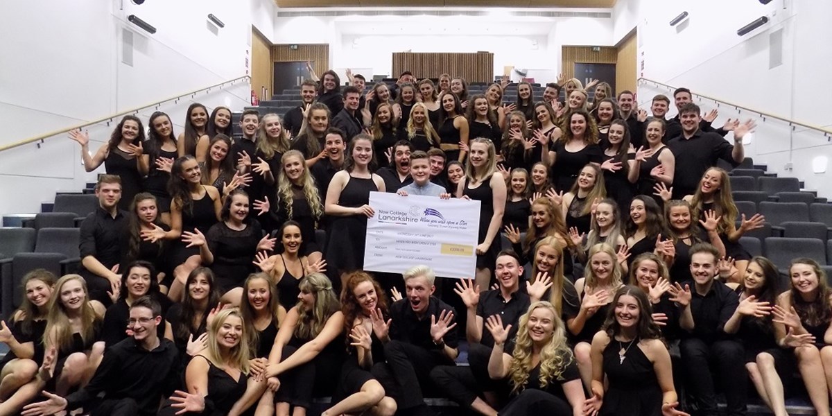Musical theatre students present cheque to toby etheridge